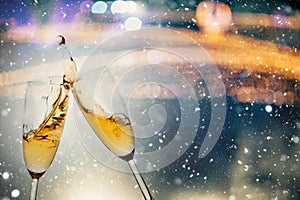 New Year& x27;s Eve concept with bokeh, fireworks and glasses of champagne