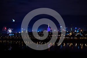 New Year`s fireworks show in Warsaw, Poland at night, view from the Vistula River