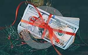 New Year& x27;s gift 100 USA dolllars against the background of the American currency