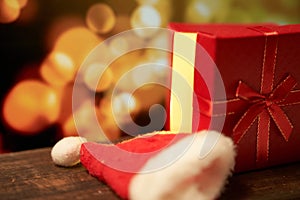 New year`s gift on a wooden table with a bokeh background