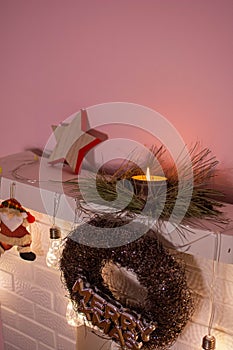 New Year's gifts lie under the tree. Snow-covered tree near the fireplace. New Year's decor of the interior