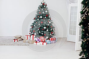 New Year`s Happy Christmas Tree decor presents interior postcard