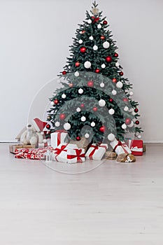 New Year`s Happy Christmas Tree decor presents interior postcard