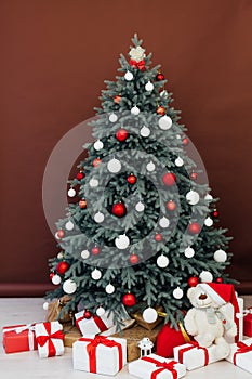 New Year`s Happy Christmas Tree decor presents interior postcard