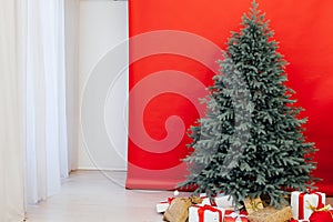 New Year`s Happy Christmas Tree decor presents interior postcard