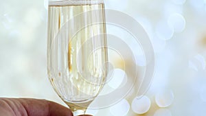 New Year`s holidays. A glass of champagne, a toast from the first person