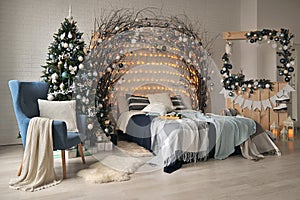 New Year`s interior in blue shades with a large Christmas tree