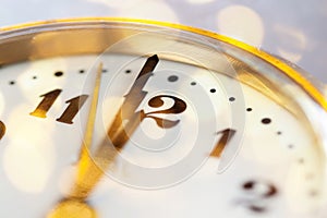 new Year& x27;s at midnight - clock at twelve o& x27;clock with holiday lights