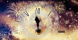 new Year& x27;s at midnight - clock at twelve o& x27;clock with holiday lights and fireworks