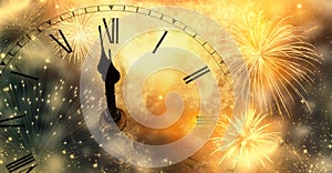 new Year& x27;s at midnight - clock at twelve o& x27;clock with holiday lights and fireworks