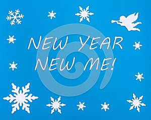 New Year's motivational card. Text NEW YEAR NEW Me on a blue background with Christmas snowflakes, a white angel