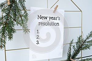 NEW YEAR'S RESOLUTION paper note on Dream board promises and aims. Preparation for new year new life new me