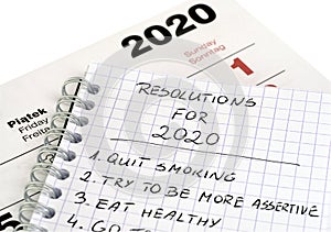 New Year`s resolutions in a notepad