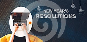 New Year`s Resolutions with person using a laptop