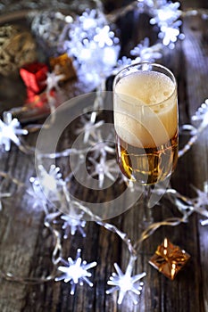 New Year's spirit: glass of champagne and Christmas decoration