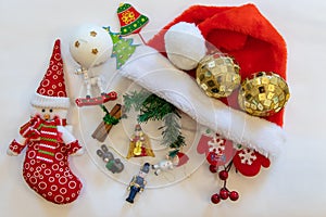 New Year`s still-life, a type of flatness. Snowman red, Christmas balls, Christmas figures, candle. photo
