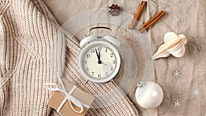 New year`s stop motion with snowflakes on a linen tablecloth and a knitted sweater. The concept of new year`s eve