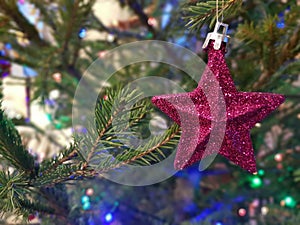 New Year`s toy on the Christmas tree star, background