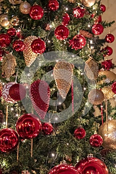 New Year\'s toys on a Christmas tree with lights. Christmas blurred background