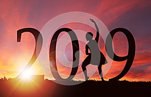 2019 New Year Silhouette of Girl Dancing at Golden Sunrise