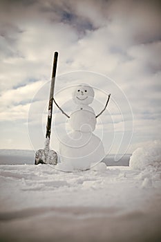 New year snowman from white snow outdoor.