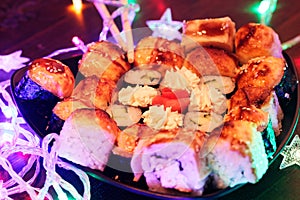 New Year Sushi. Beautiful food photo with Christmas garland.