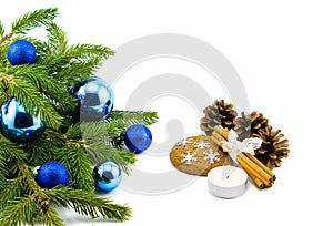 New year theme: Christmas tree, blue balls, decorations, candle, snowflakes, cookies, cones, cinnamon isolated