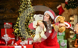 New year tips and ideas. happy girl at xmas party. christmas shopping sales. happy santa woman bear toy present. at the