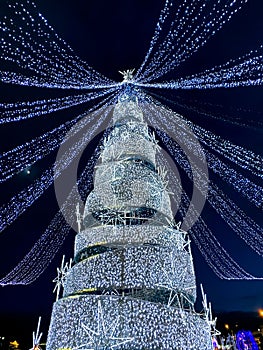 New year tree with christmas lights. winter holiday illumination