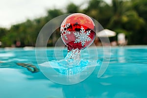 New year tree decoration splashes from the bleu water