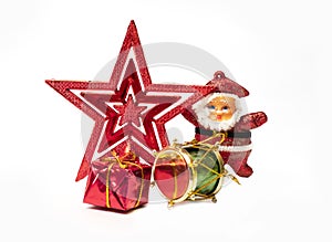 New year tree ornaments: red Christmas star, gift box, a shiny drum, and a Santa Claus miniature