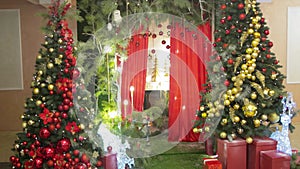 New Year trees with gifts and colorful decorations and balls and New Year lights. New Year and Christmas holiday. Copy