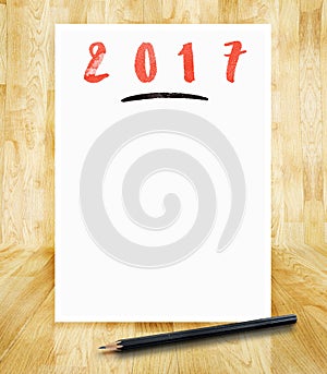 2017 new year on white paper frame with pencil in hand brush sty