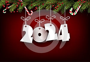 New Year 2024 white paper numbers for calendar header with candies, berries and green fir branches on red background