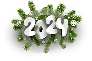 New Year 2024 white paper numbers on realistic green fir twigs and snowflakes