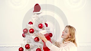 New year woman. Happy young lady gifts by the fireplace near the Christmas tree. New year concept. Christmas tree