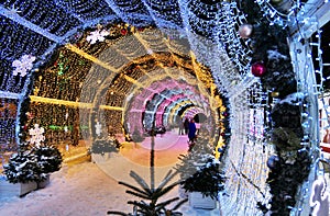 New year and Xmas street decoration in night illuminated Moscow, LED light tunnel