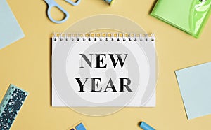 New year new you text on notepad with office