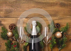 New Years Christmas Celebration Background with Pair of Wineglasses and Bottle of Champagne Christmas New Year Card Fir Decoration