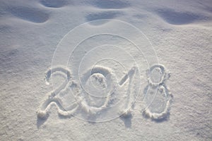 New years date 2018 written in snow.