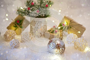 New Years decoration ball on snow background