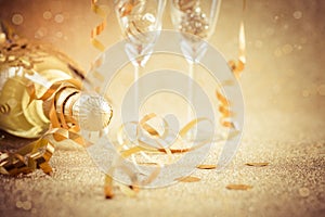 New years eve celebration background with champagne, glasses and ornaments