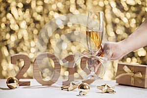 New Years Eve celebration background with pair of flutes, bottle