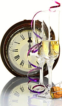 New years eve celebration with clock showing few minutes before midnight