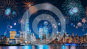 New Years Eve with colorful Fireworks over New York City skyline long exposure with beautiful dark blue sky, sci-fi orange city