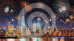 New Years Eve with colorful Fireworks over New York City skyline long exposure with beautiful dark blue sky, sci-fi orange city