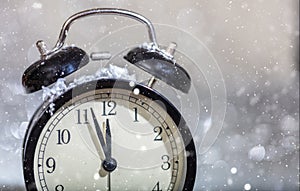New Years eve countdown. Minutes to midnight on a vintage alarm clock