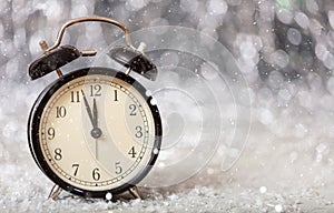 New Years eve countdown. Minutes to midnight on a vintage alarm clock