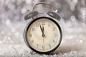 New Years eve countdown. Minutes to midnight on a vintage alarm clock