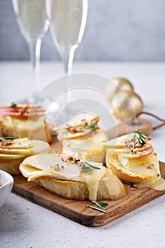 New Years Eve party appetizer, pear and brie crostini